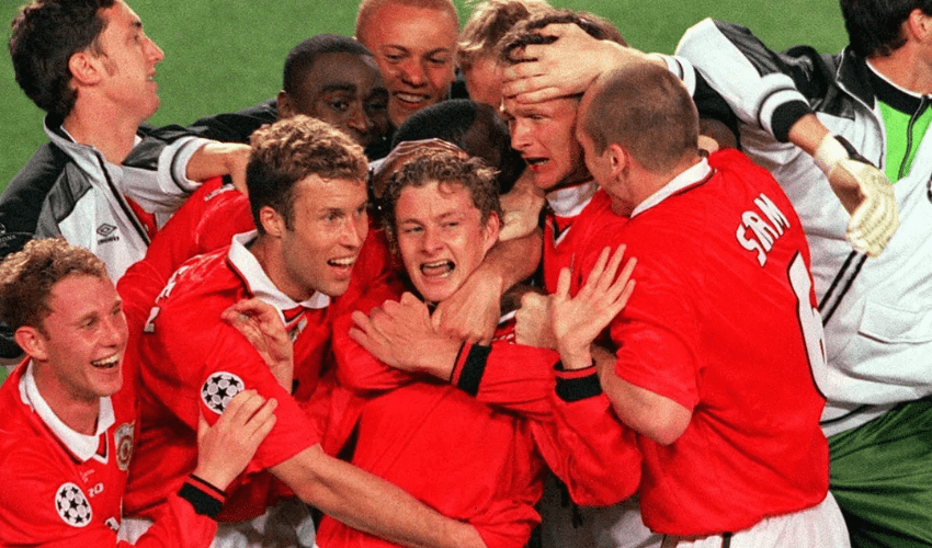 Manchester United celebrating their 1999 UEFA Champions League triumph, with striker Ole Gunnar Solskjaer at the centre of proceedings.