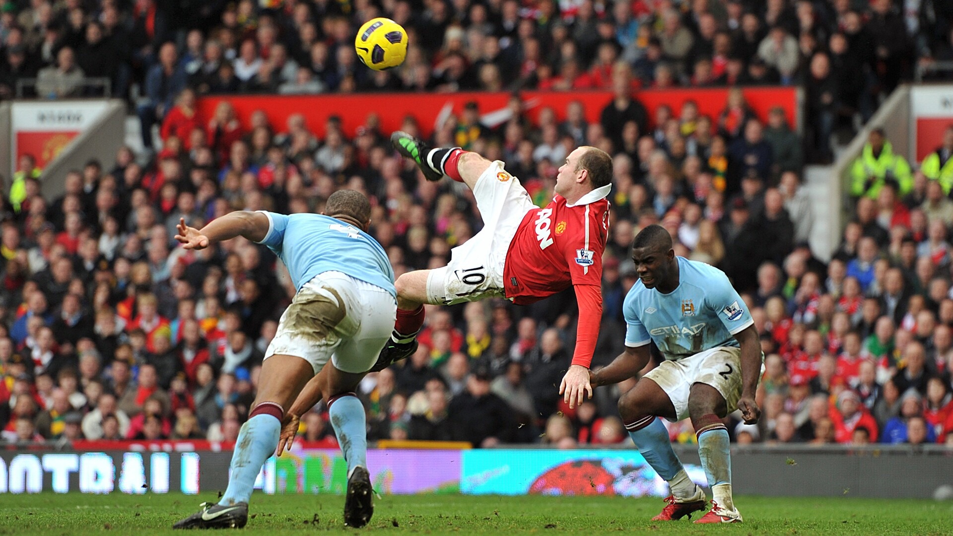 Wayne Rooney leaps in between Vincent Kompany and Micah Richards to score one of the most iconic goals that the Barclay's Premier League has ever seen.