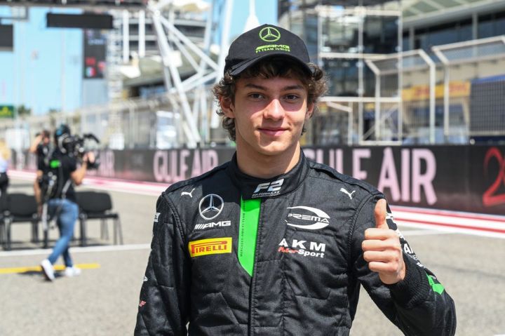 Antonelli smiling on racing track. 