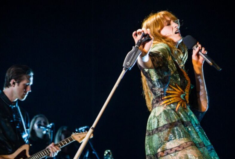 Florence + The Machine performing on stage.