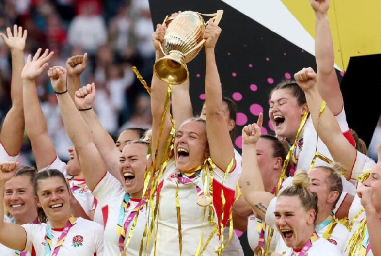 England Women celebrating whilst lifting their trophy - winning World Cup 2025
