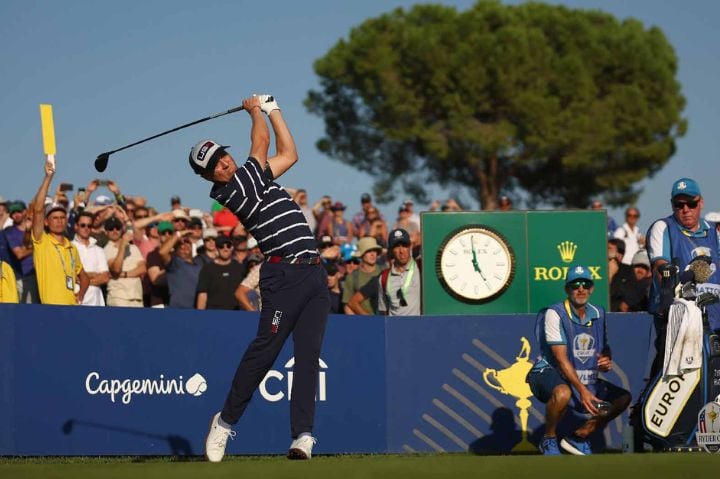 player driveing down the course - ryder cup 2025 