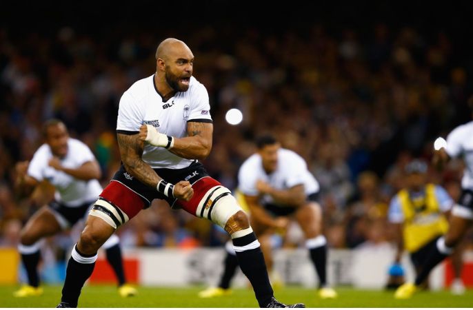 Netani Little doing the Haka on rugby pitch 